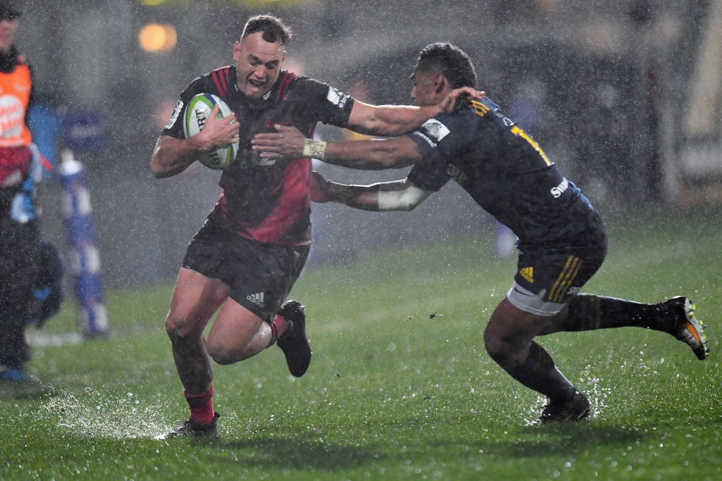 Israel Dagg of the Crusaders is tackled by Waisake Naholo of the Highlanders. Photo: Getty