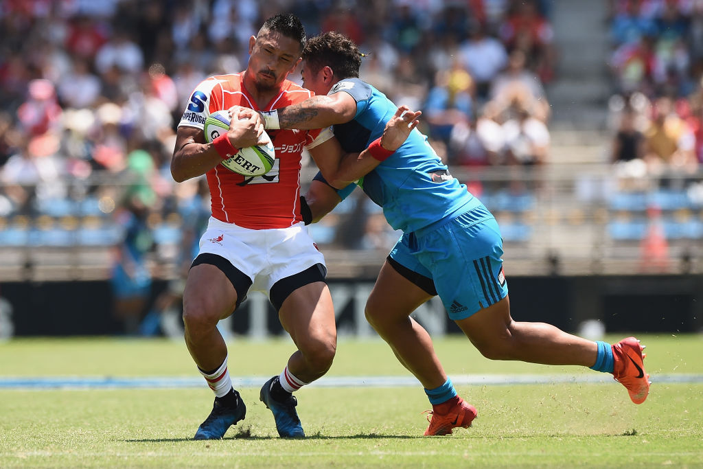 Fumiaki Tanaka of the Sunwolves is tackled by Augustine Pulu of the Blues. Photo: Getty