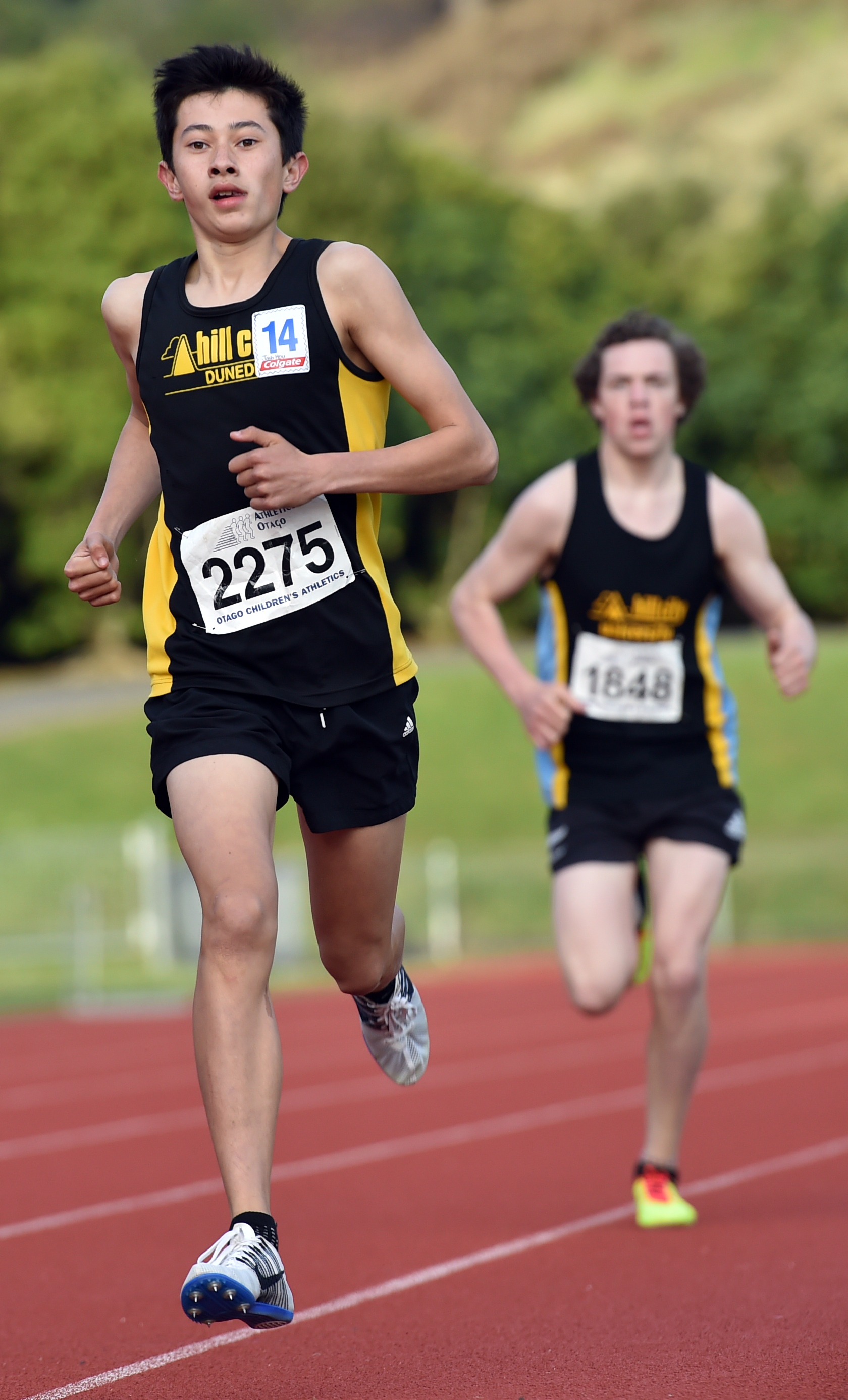 Josh Hou (14), of John McGlashan College, wins the Ness Cup handicap mile from Drew Cairney (16),...