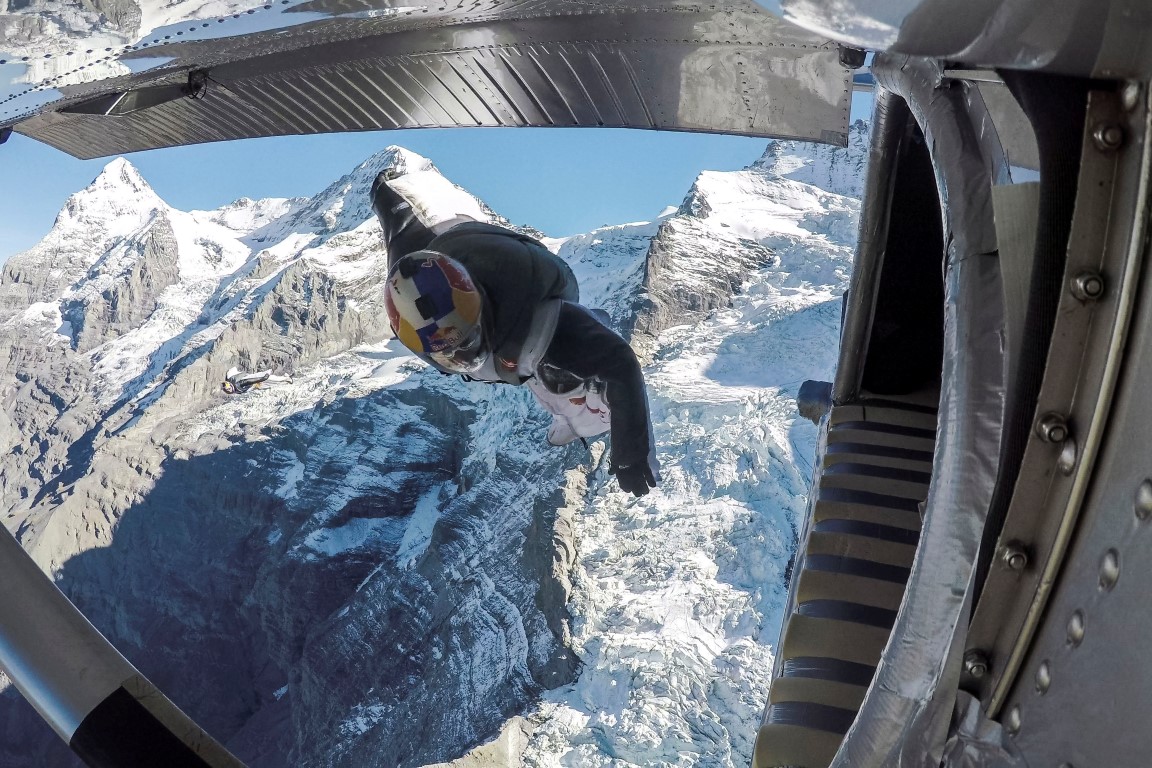 One of the wingsuit duo prepares to fly into the aeroplane. Photo: Reuters