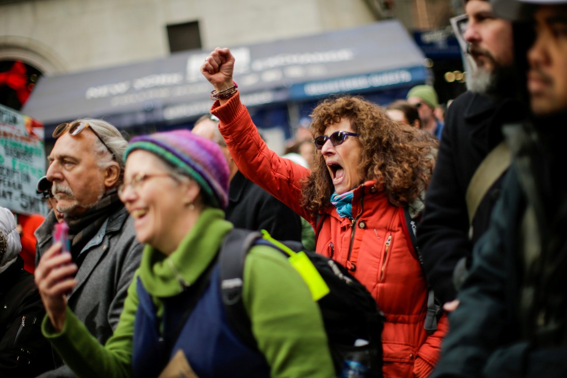 Opponents of the tax reforms protest next to the New York Stock Exchange in Manhattan. Photo:...