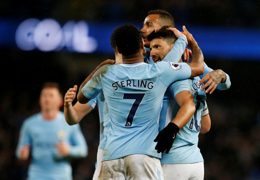 Sergio Aguero is congratulated by teammates after scoring his fourth goal for Manchester City....