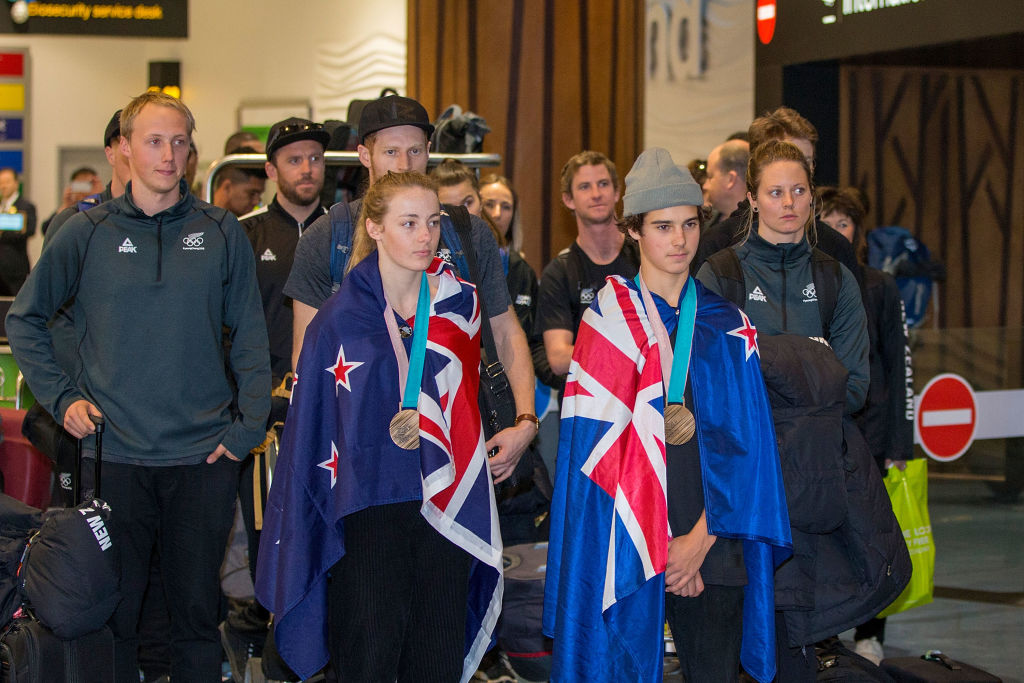 Zoi Sadowski-Synnott (L) and Nico Porteous are welcomed home at Auckland International Airport...