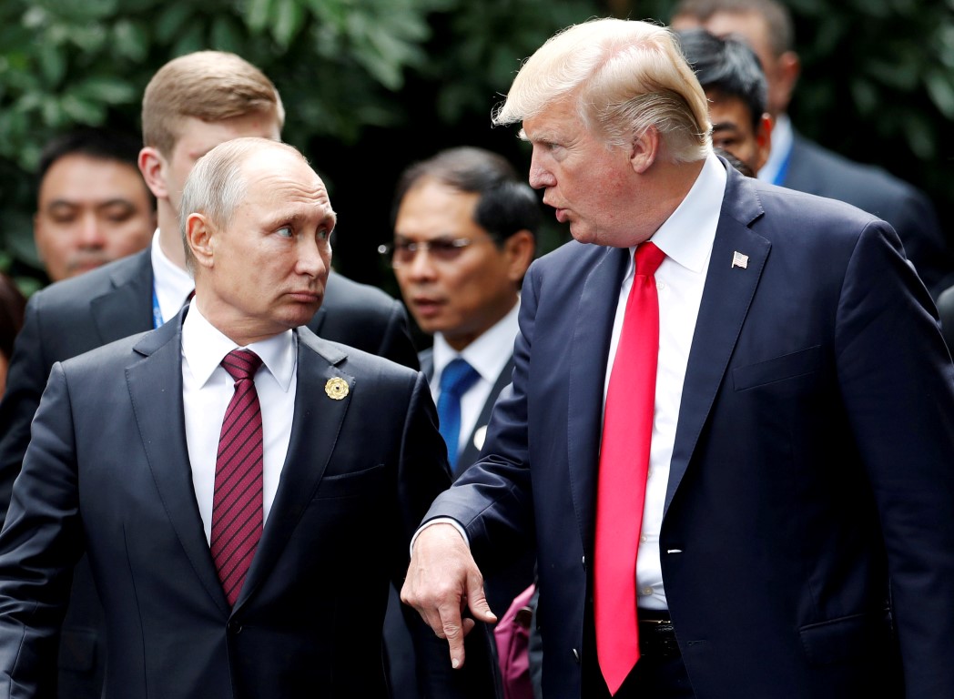 US President Donald Trump and Russia's President Vladimir Putin talk at the APEC Summit in Danang...