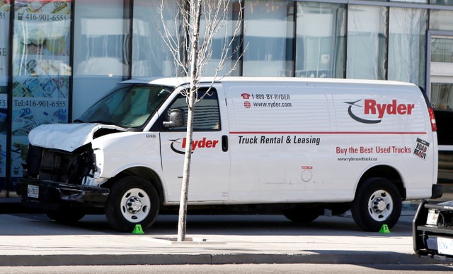 A van seized by police lies damaged after an incident where a van struck multiple people at a major intersection in north Toronto. Photo: Reuters