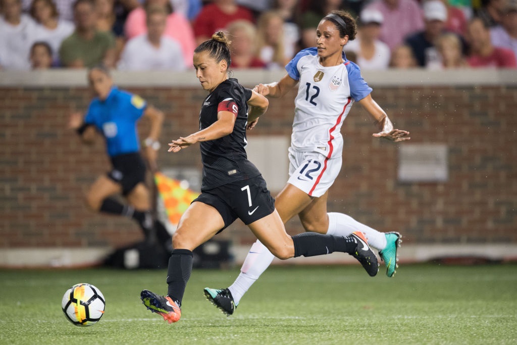 The Football Ferns' Hannah Wilkinson on the run against the USA as she is chased down by Lynn...