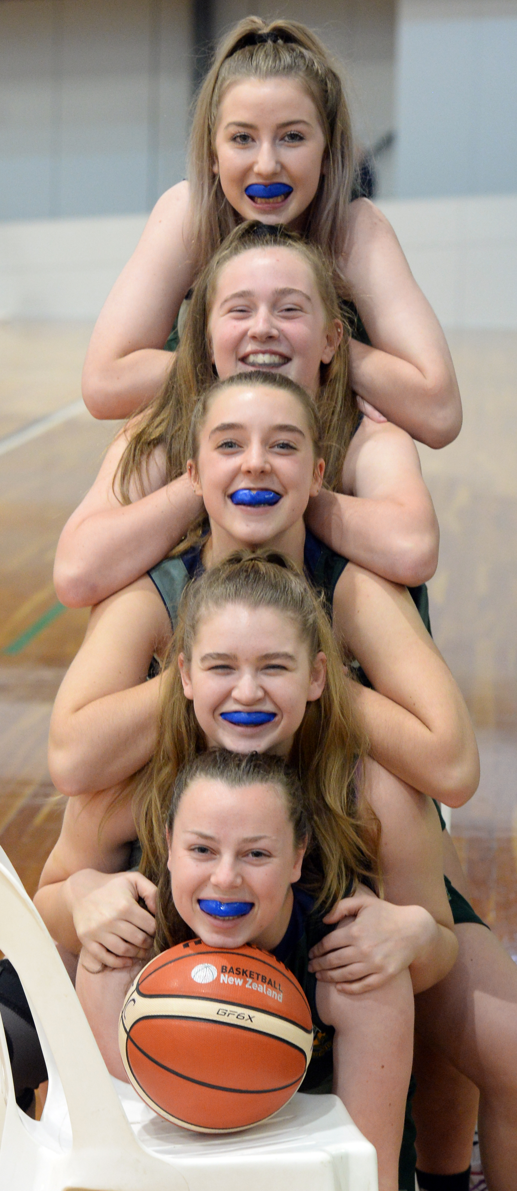 Members of the Bayfield High School senior A basketball team proudly show off their mouthguards...