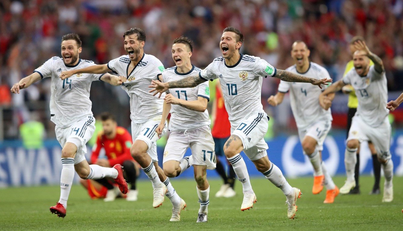 Russian players celebrate their victory over Spain. Photo: Reuters