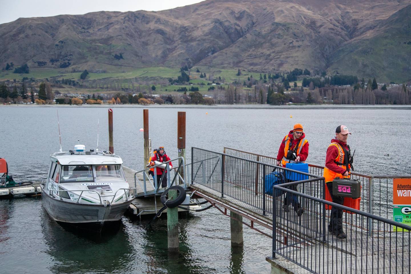 Dive tanks brought ashore on Lake Wanaka during the search for helicopter pilot Matthew Wallis....