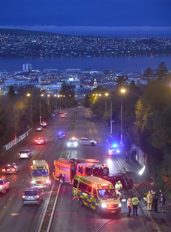 St John Ambulance officers, firefighters and police join forces to help at the scene of a fatal...