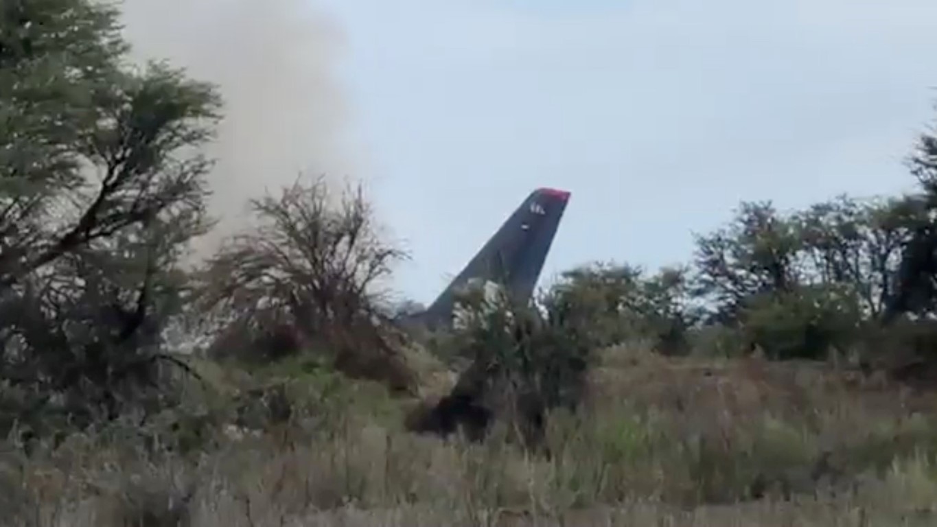 Smoke billows above the crashed jet, in this still image taken from video. Photo: Reuters