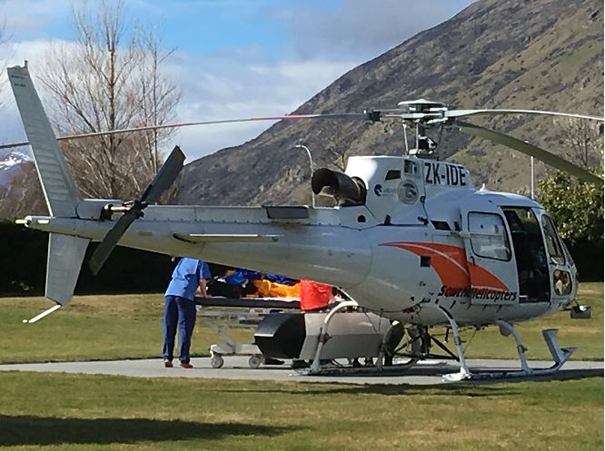 A Southern Lakes rescue helicopter unloads a man seriously injured in an avalanche at Lakes...