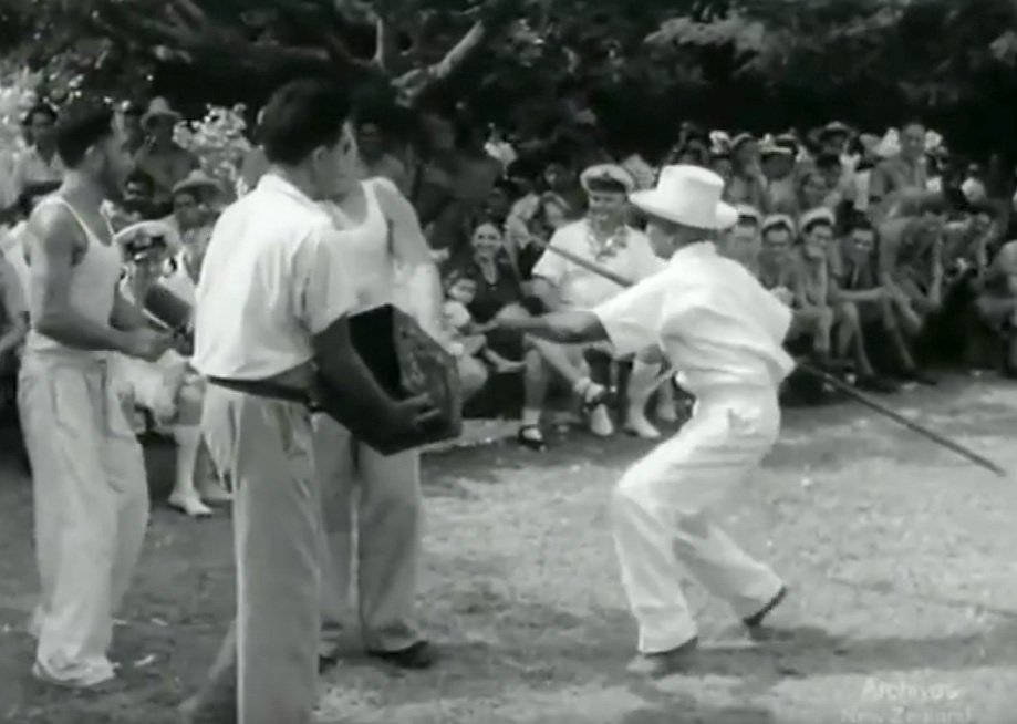 A still from the New Zealand National Film Unit clip, that shows Samuela Ariki, all in white,...