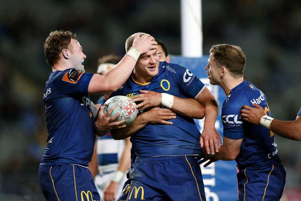 Otago's Matt Faddes is congratulated by teammates after scoring a try against Auckland at Eden...