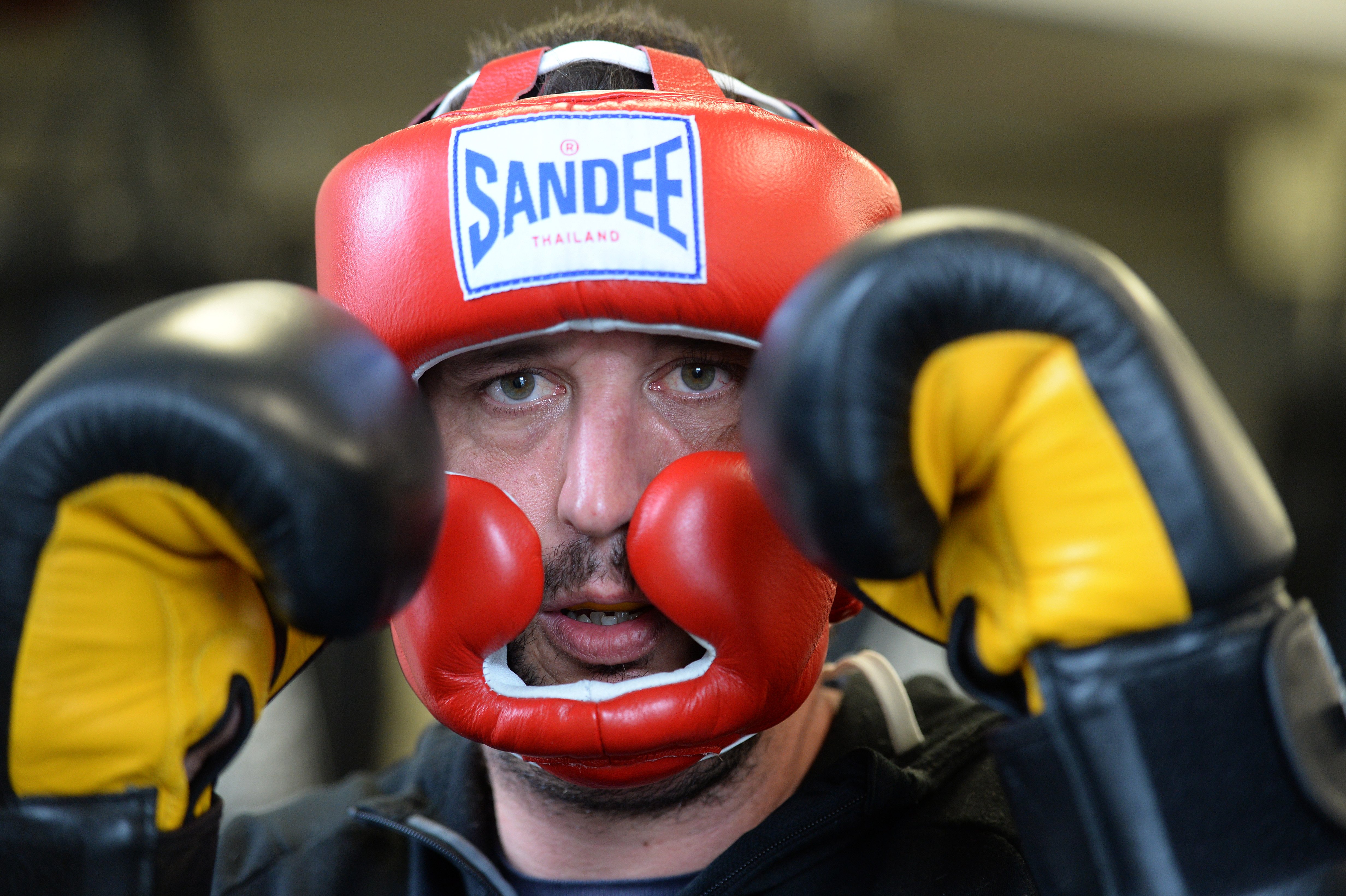 Coach Ryan Henry squares up at the NZ Fight and Fitness Academy in Dunedin yesterday wearing the...