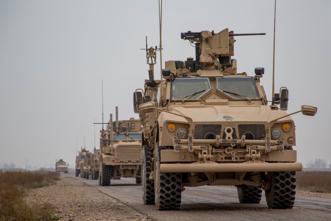 Armoured vehicles belonging to US-led coalition forces in the Middle Euphrates River Valley in...