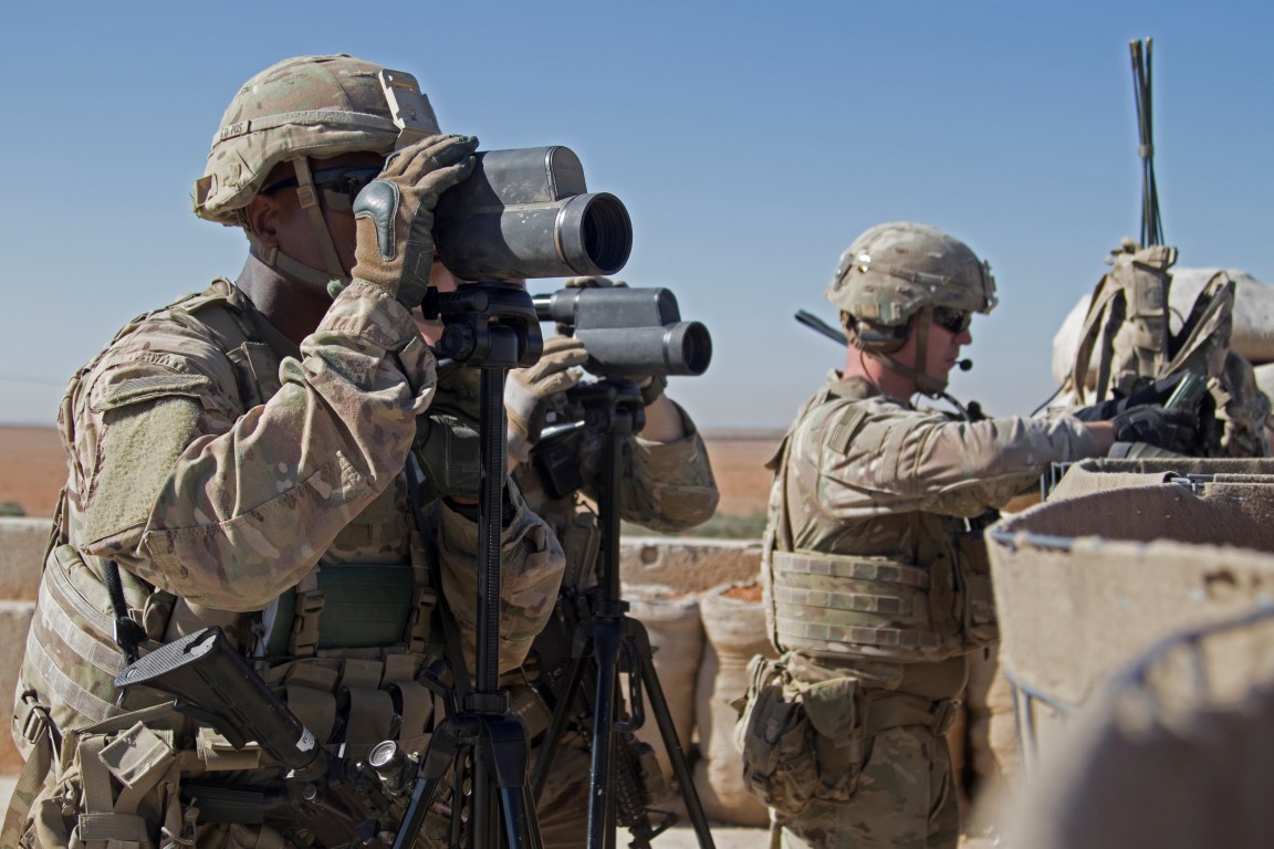 US soldiers on surveillance during a combined joint patrol in Manbij, Syria, in November. Photo:...