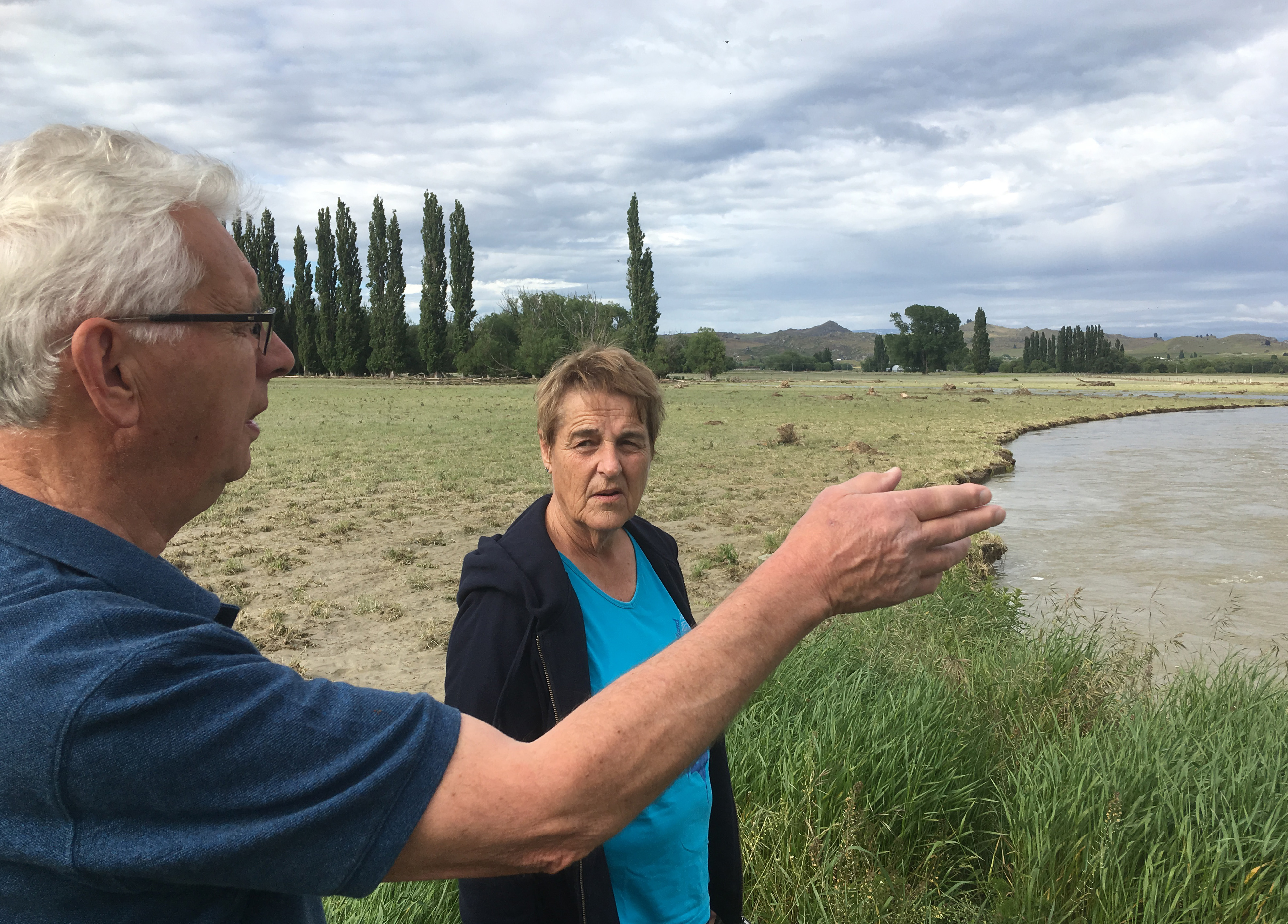 Ophir residents Malcolm Topliss  and Irene Leask  investigate the damage caused to local farmland...