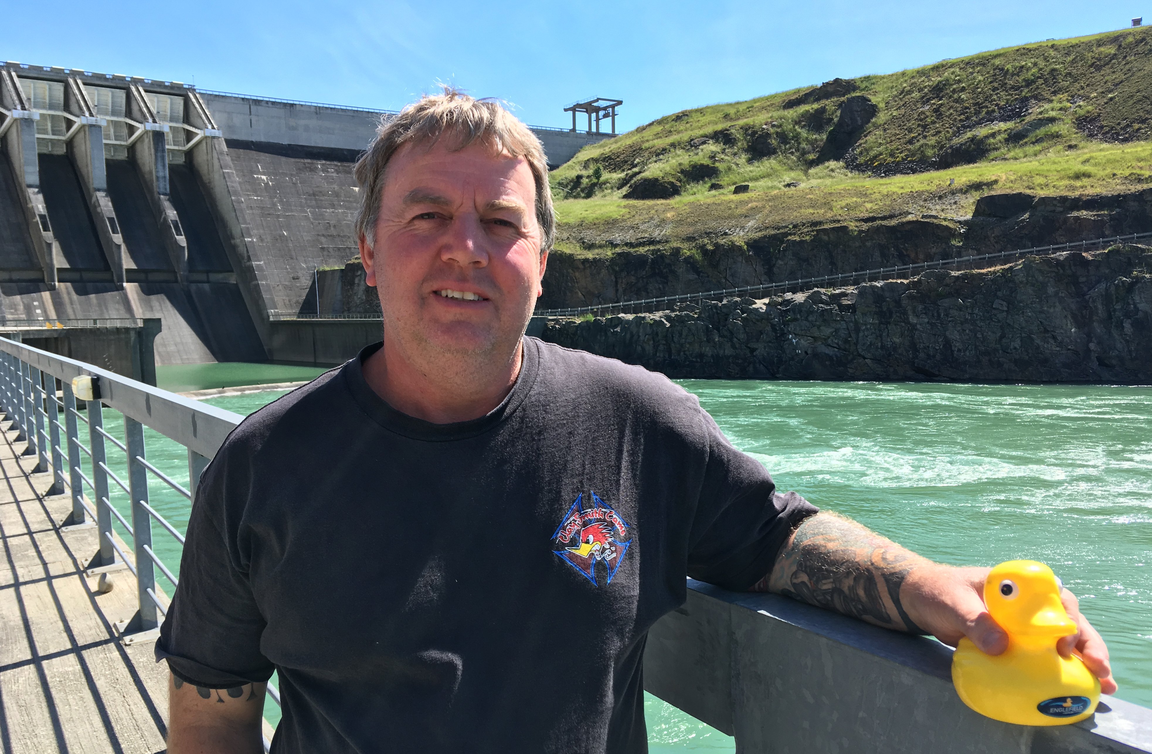 Contact Energy site support manager Clayton Andrews holds the plastic duck retrieved on November...