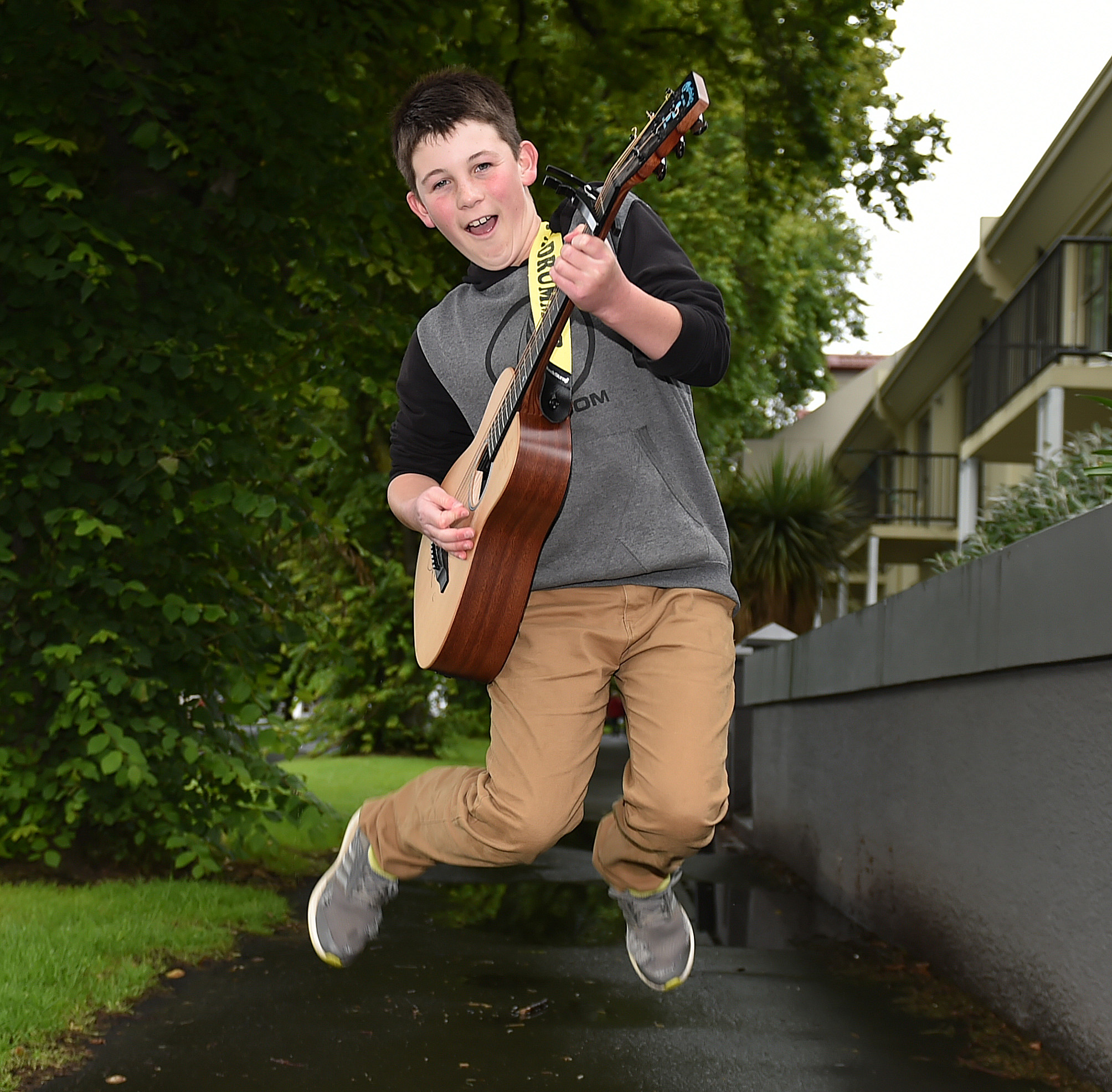 Busker Rylan Urquhart (13), of Dunedin, gets amped up to entertain Shania Twain concert goers...