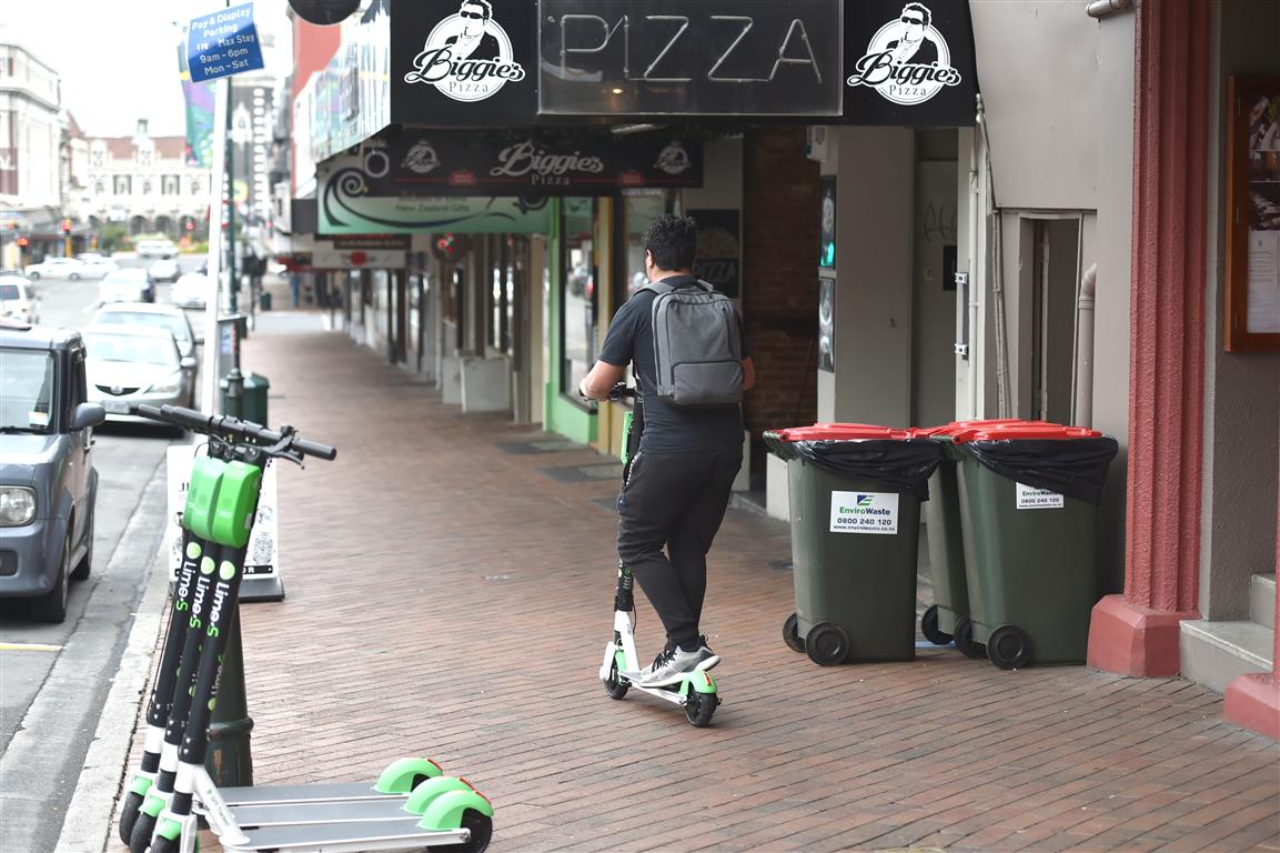 A Lime scooter rider in Dunedin. Photo: ODT