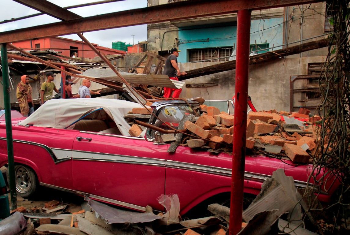 Debris lies on a car after the tornado. Photo: Reuters