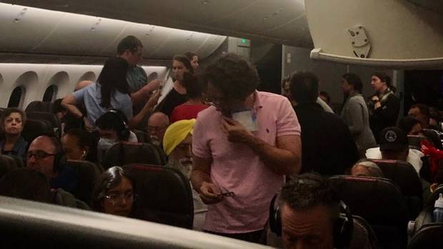 Passengers on American Airlines flight 82 that had to be diverted to Honolulu after a passenger...