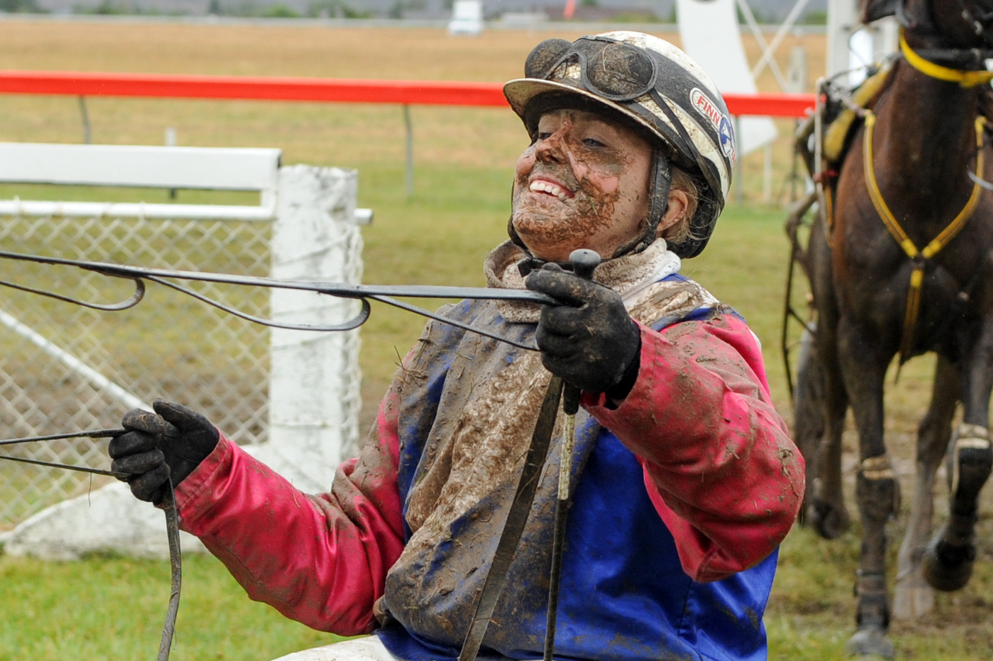 Sheree Tomlinson is all smiles  after driving  War Admiral to victory  at Cromwell yesterday....