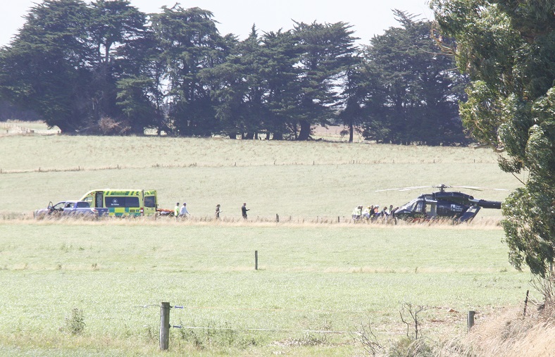 Emergency crews carry the injured man to a waiting rescue helicopter. Photo: Giordano Stolley 
