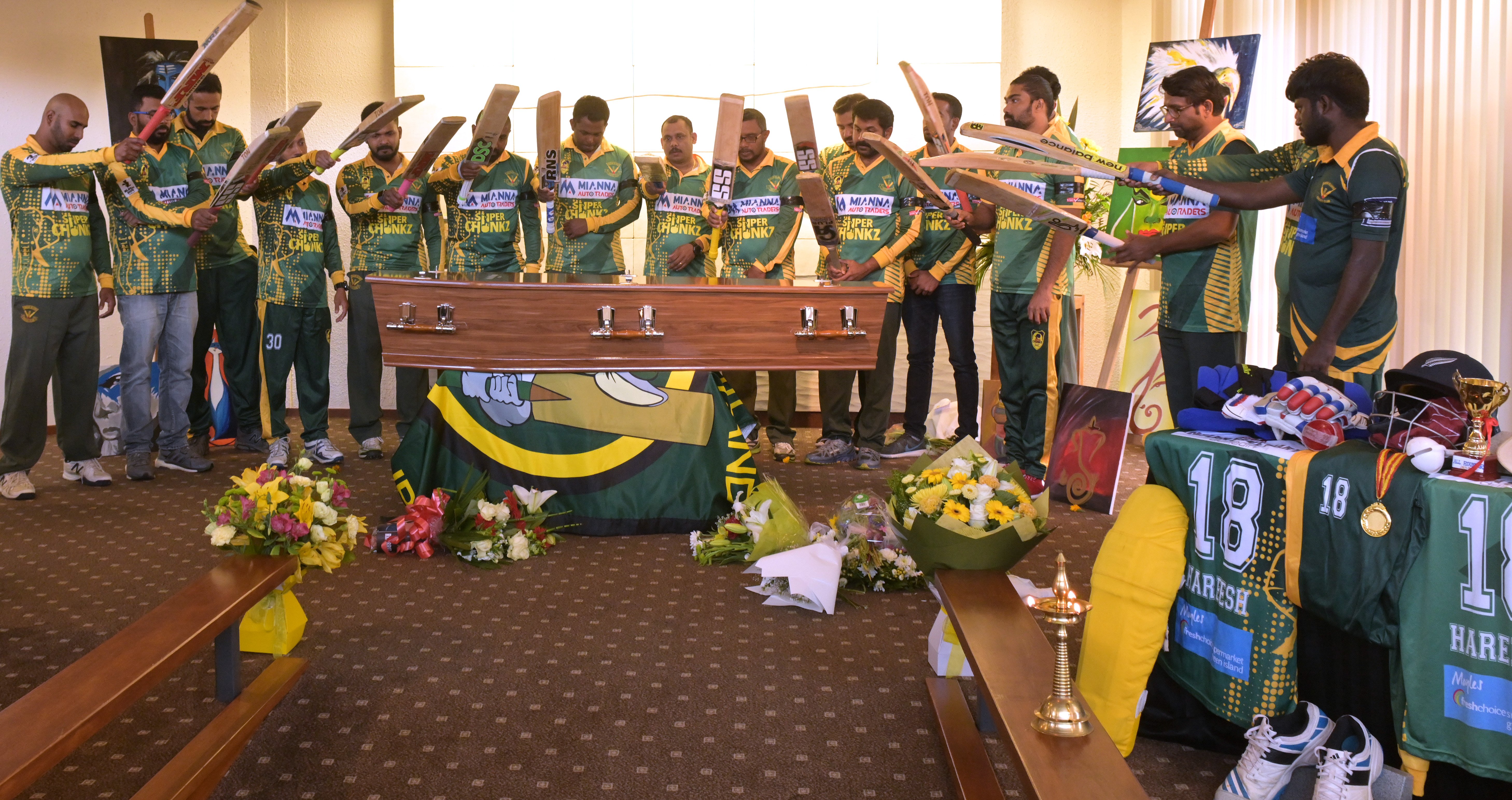 Members of the Green Island Super Chunkz cricket team form a final guard of honour on Saturday at...