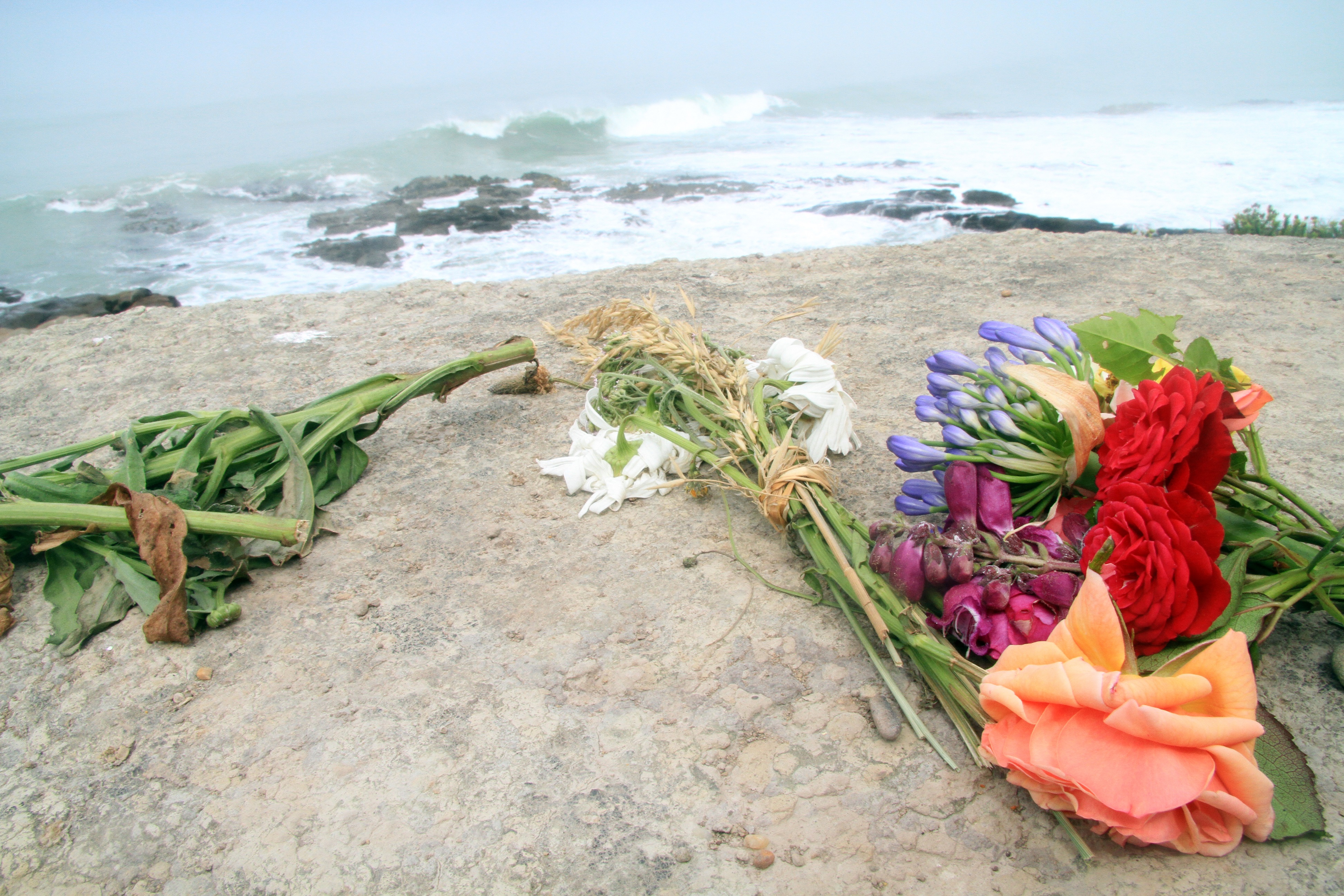 Flowers have been left where brothers died collecting seafood at Kakanui on Tuesday evening....