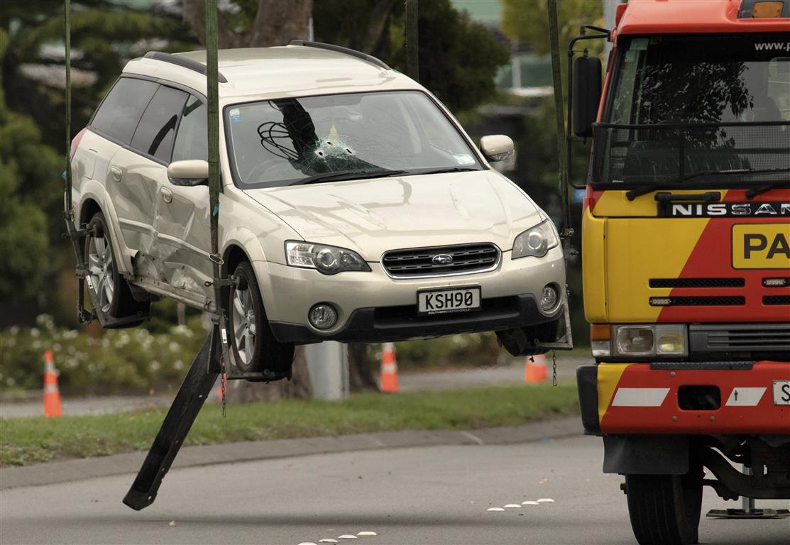 The accused gunman's car being removed from Brougham St after he was apprehended. Photo: AP 