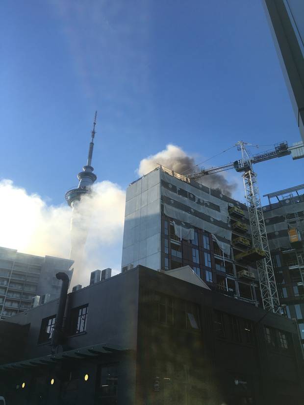 Smoke can be seen billowing from the building. Photo: Sarah Pritchett