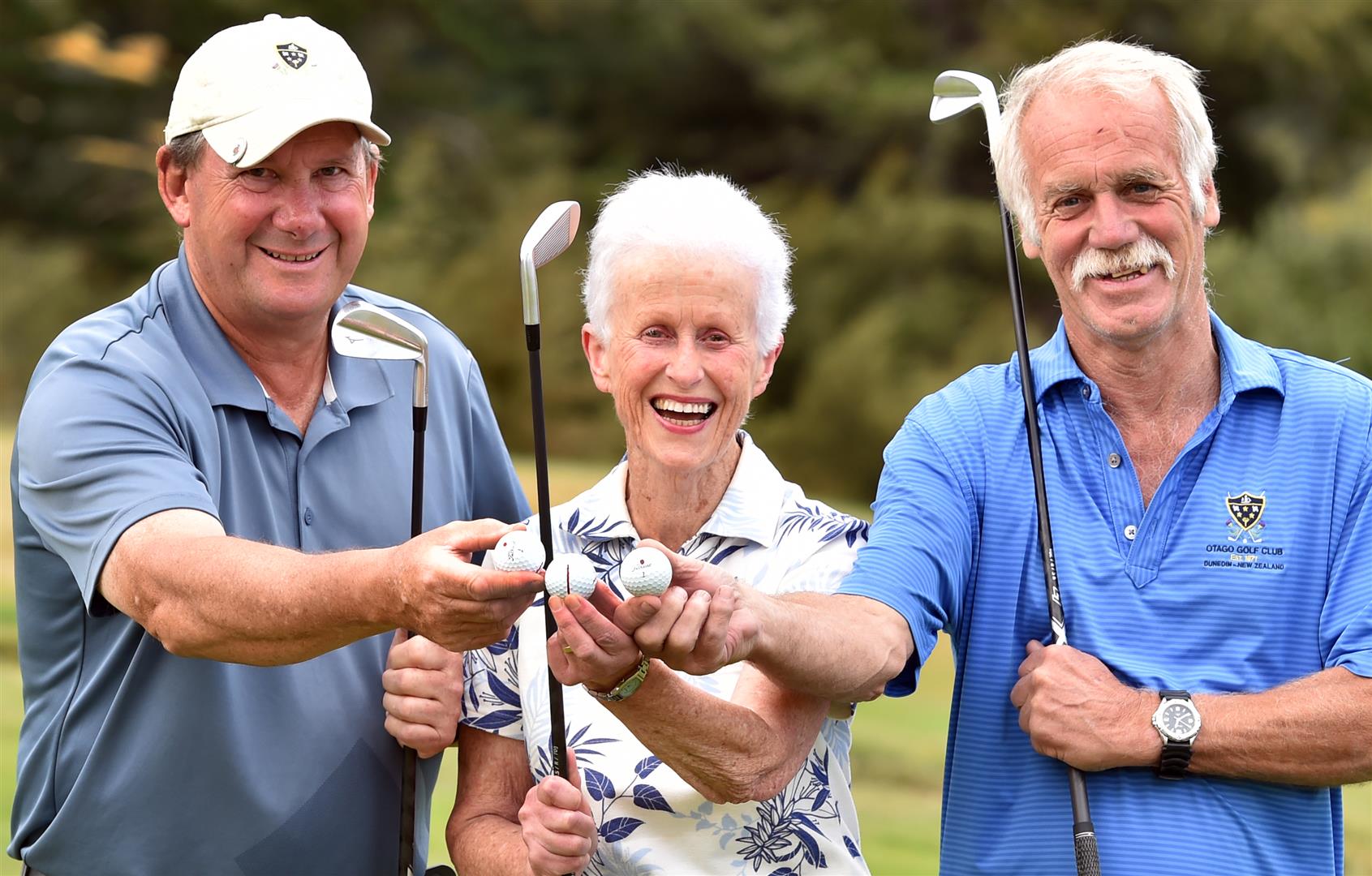 Celebrating their talents in each scoring a hole in one at the Otago Golf Club's Balmacewen course are (from left) Dean Parsons, Lillian Bartlett and Trevor King. Photo: Peter McIntosh