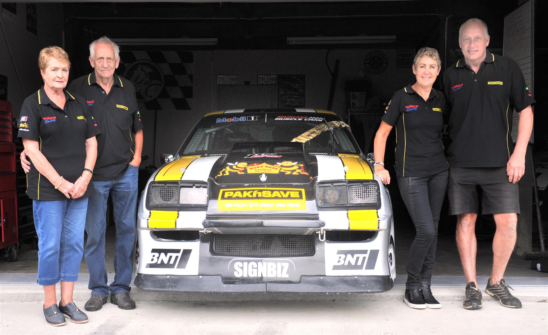 Rose and Colin Wallace (left) and Michelle and Mike Wallace with their muscle car. Photo: Christine O'Connor