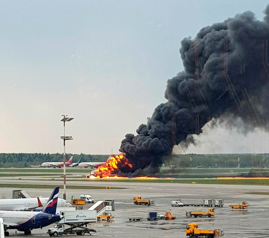Smoke rises from the burning plane at Moscow's Sheremetyevo airport. Photo: Riccardo Dalla...