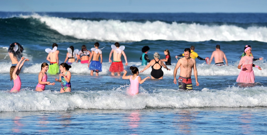 Participants in the 91st Polar Plunge at St Clair beach on Sunday. Photo: Christine O'Connor