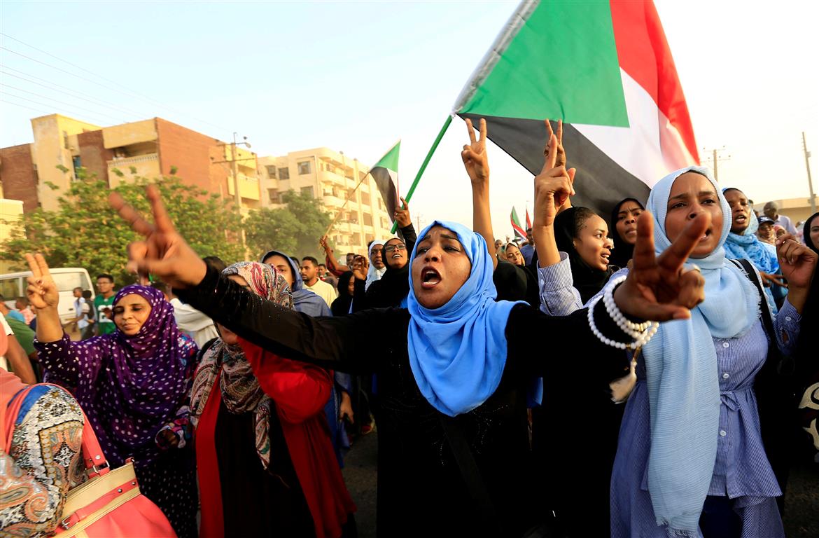 Sudanese protesters march during a demonstration to commemorate 40 days since the sit-in massacre...