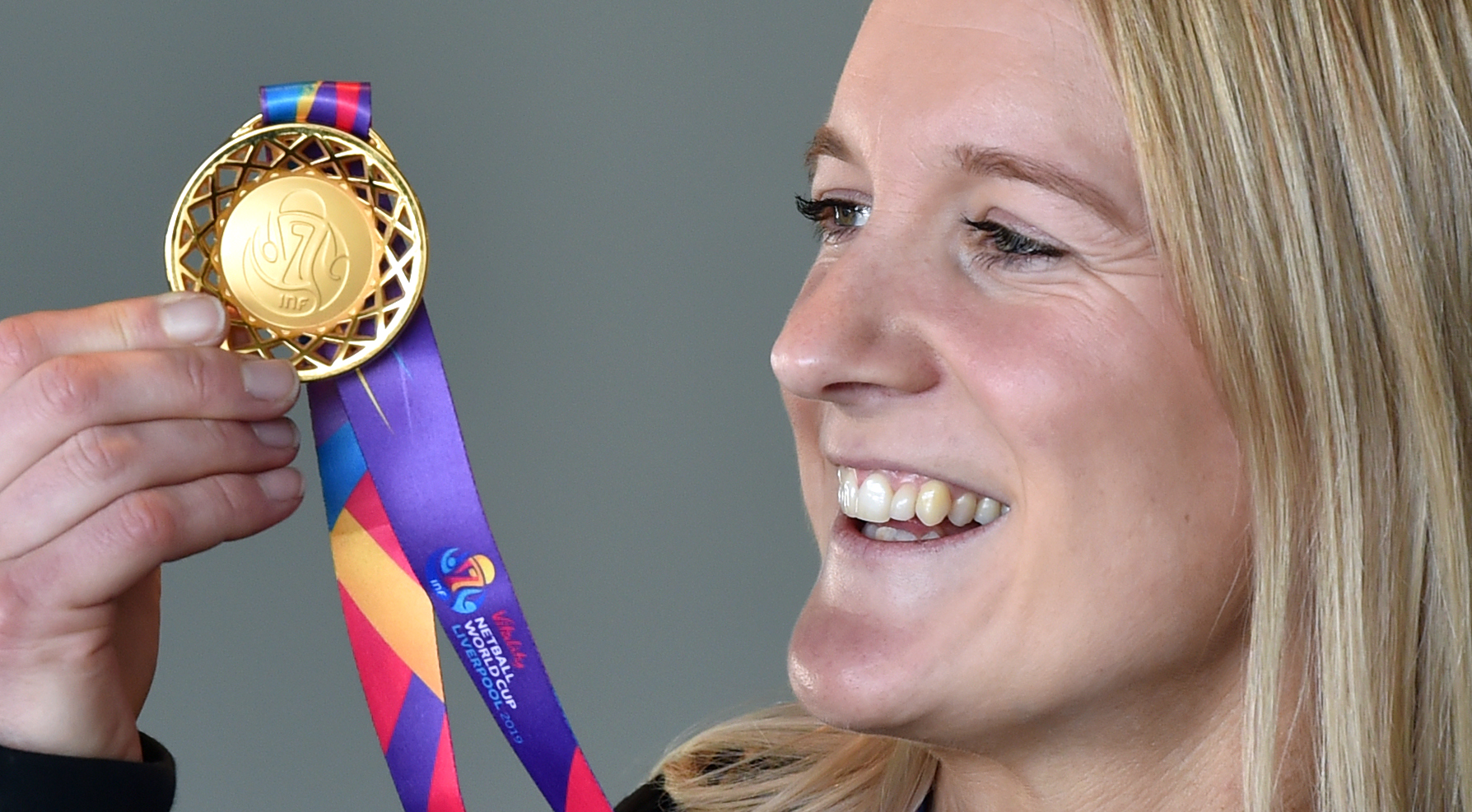 Shannon Saunders was all smiles as she held her World Cup gold medal yesterday at the Edgar...