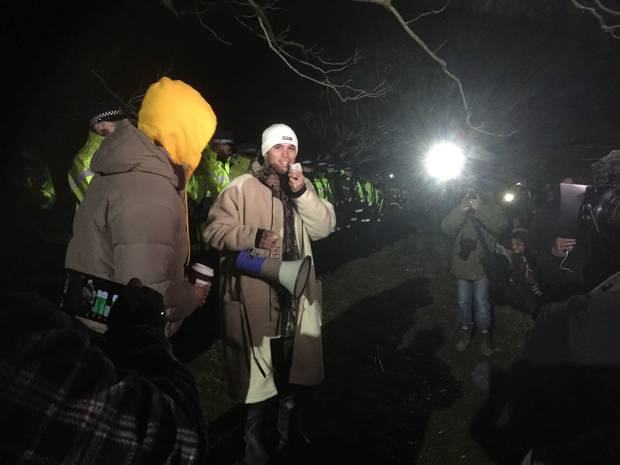 Stan Walker spoke to the crowd in front of police. Photo: NZ Herald