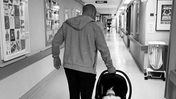 Aaron Smith leaves hospital with his son Luka. Photo: Instagram