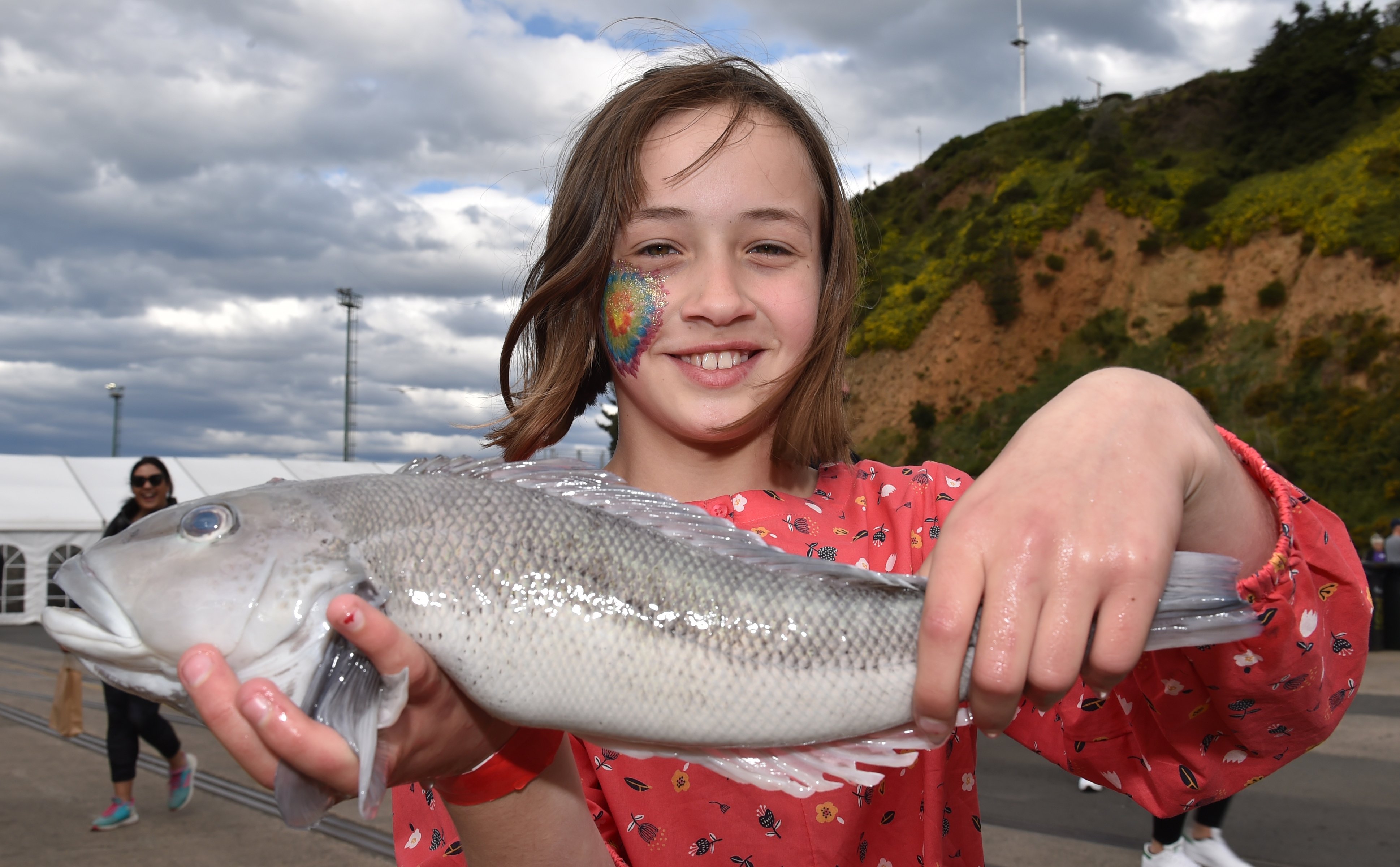 Sienna Brits (11) holds her 1.2kg blue cod, the winning catch at a fishing competition at the...