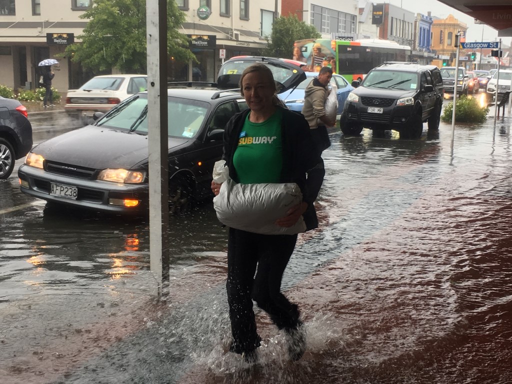 Surface flooding inundated Gordon Rd in Mosgiel this afternoon. Photo: Stephen Jaquiery