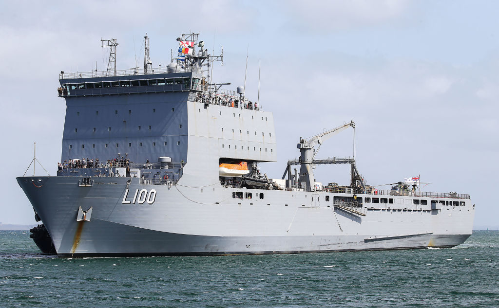 The beer is being delivered by crew on HMAS Choules. Photo: Getty