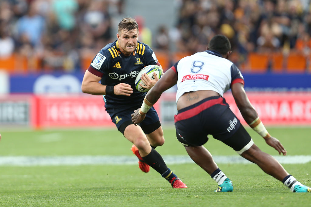 Michael Collins makes a break for the Highlanders against the Rebels. Photo: Getty