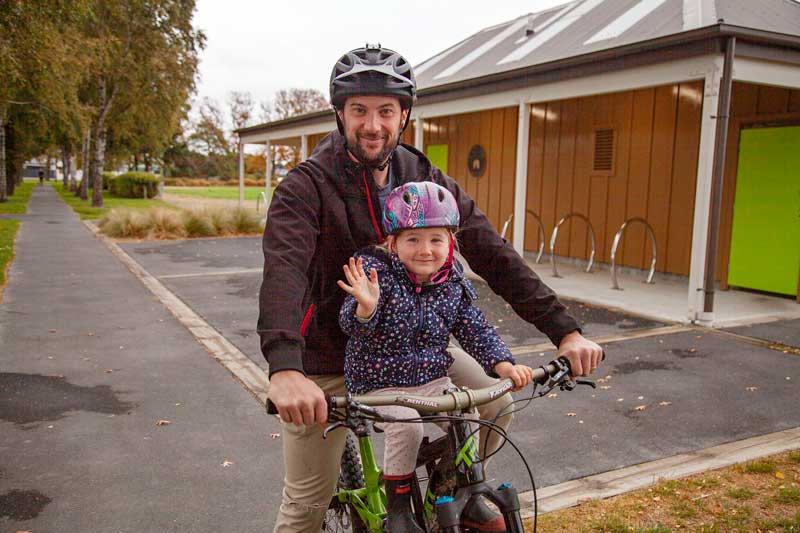 Andrew Peck and his daughter Myka Peck, 3, of St Albans get some exercise and have fun while...