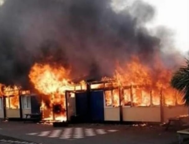 Classrooms at the school engulfed by flames. Photo: Supplied via Facebook