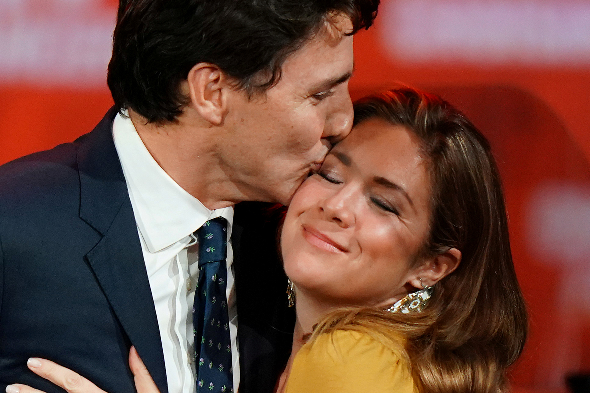 Justin Trudeau and his wife Sophie Gregoire Trudeau hug on stage after the federal election at...