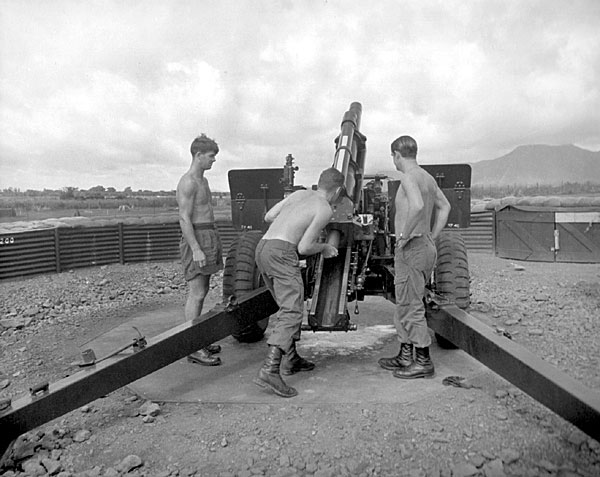 Vietnam War. Members of 161 Battery, Royal New Zealand Artillery, carry out a fire mission.