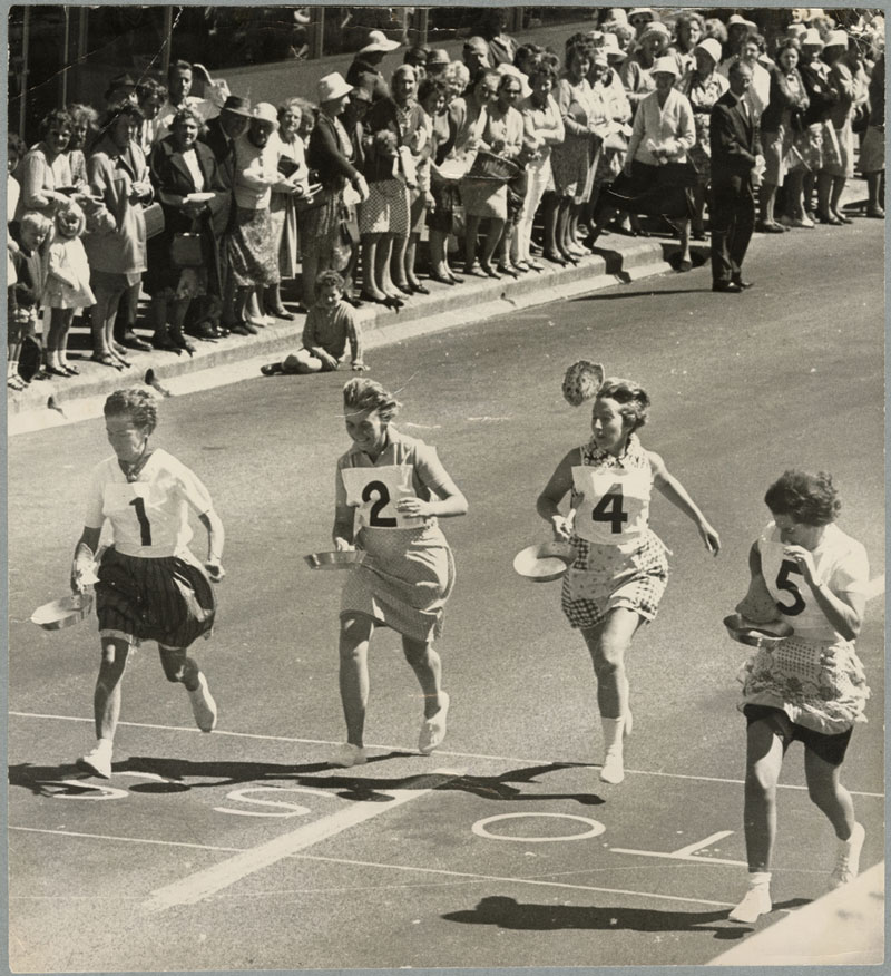 Competitors in full flight during the Shrove Tuesday pancake race at New Brighton in 1970.